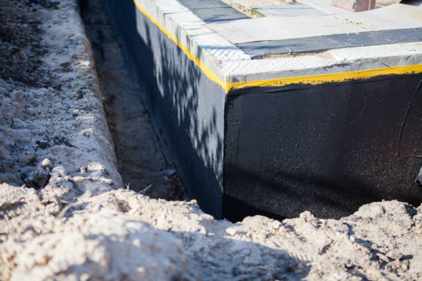 Professional Waterproofing technician working in Columbia City, IN